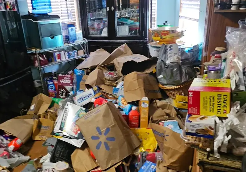 Cluttered dining room before a discreet Top Klean hoarding cleanup